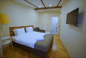 TV a/nebo společenská místnost v ubytování Hotel Cordata