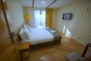 Postelja oz. postelje v sobi nastanitve Hotel Cordata