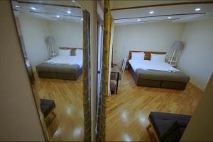 Postelja oz. postelje v sobi nastanitve Hotel Cordata