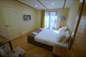 Postelja oz. postelje v sobi nastanitve Hotel Cordata