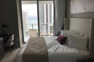 a bedroom with a large bed and a large window at Hollywood Beach luxury condo-HBH in Hollywood +63 photos