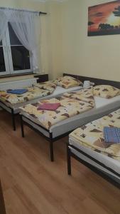 Posteľ alebo postele v izbe v ubytovaní Pokoje Relaks 2