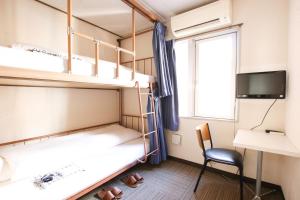 Letto o letti in una camera di Sakura Hotel Jimbocho