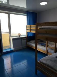 a room with two bunk beds and a window at Apartment on Chernyakhovskogo 5V in Vladivostok