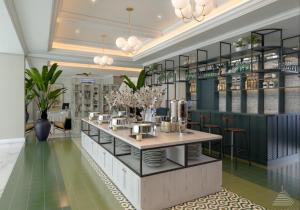a rendering of a restaurant with a table and chairs at Jambuluwuk Thamrin Hotel in Jakarta