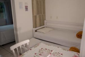 Postel nebo postele na pokoji v ubytování Residencial Neto