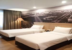 Postel nebo postele na pokoji v ubytování GiiA Sanno Hotel Pluit