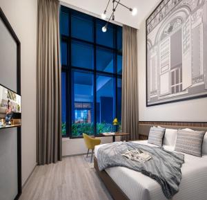 Citadines Rochor Singapore客房内的一张或多张床位