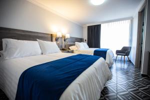 מיטה או מיטות בחדר ב-Hotel Esfera Tulancingo