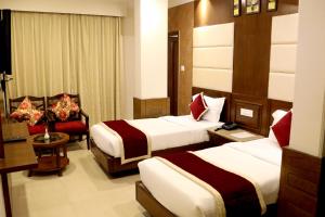 Hotel Shagun Chandigarh Zirakpur客房内的一张或多张床位