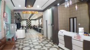 a lobby of a store with a counter and a restaurant at Nasional Hotel in Gunungsitoli +31 photos