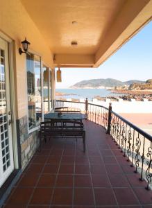 A balcony or terrace at Matsu Island View Restaurant Bed and Breakfast