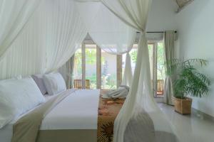 Ένα ή περισσότερα κρεβάτια σε δωμάτιο στο Angels Bungalow Nusa Penida