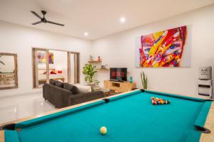 a living room with a pool table at Luxury Villa Summerlin in Canggu
