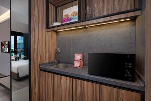 Citadines Rochor Singapore客房内的一张或多张床位