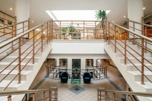 an overhead view of the lobby of a building with stairs at AZIMUT Hotel Uglich in Uglich