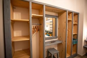 a room with wooden shelves and a window at Cielo in Sierra Nevada