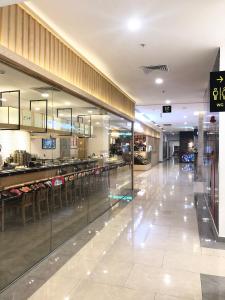 a large shopping mall with a food court in it at Luxury Condotel 2BR Vinhomes Skylake Keangnam - Netflix free in Hanoi