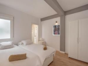 Posteľ alebo postele v izbe v ubytovaní Malaga city apartment