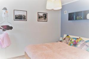 Posteľ alebo postele v izbe v ubytovaní Apartament przy Źródełku
