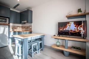 a kitchen with a fireplace in the wall at Cielo in Sierra Nevada +24 photos
