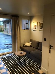 Posezení v ubytování LA MARLIERE maison de charme à la campagne