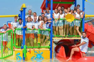 a group of people posing for a picture at a water park at Camping Village Capalonga in Bibione