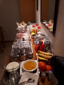 a table with many different food items on it at Pension Schöne in Großröhrsdorf