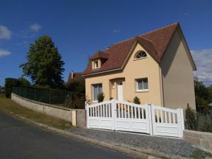 a white fence in front of a house at Chez Mado in Deauville