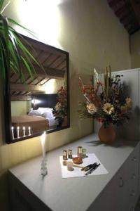 a counter with a mirror in a bedroom at Affittacamere Il Pagliericcio in Ferrara
