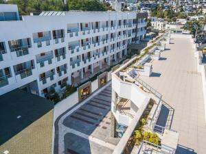 an aerial view of a white building with a street at Afytos Bodrum City in Mugla