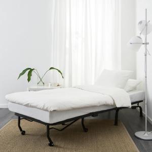 a white bedroom with a bed in front of a window at Quiet Studio City Center in Porto
