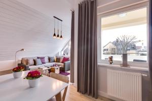 a living room with a couch and a table at Apartament Agnes blisko Term Cieplice in Jelenia Góra