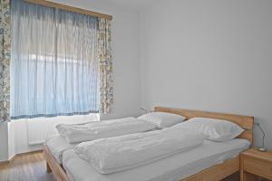 En eller flere senge i et værelse på Sölle Homes Rattendorf - Alte Schule