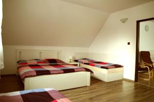 Postel nebo postele na pokoji v ubytování Apartmá Království Beskyd