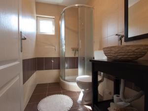 a bathroom with a shower and a toilet and a sink at Silba Otium in Silba