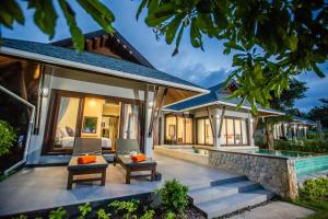 a villa with a patio and a swimming pool at 2H RESORT KOH SAMUI in Koh Samui