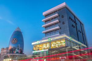 a tall building with a lot of windows at Alya Rooms in Lefkosa Turk