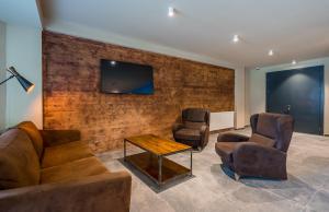 TV a/nebo společenská místnost v ubytování New Gudauri Atrium apartment #514