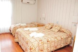 Una cama o camas en una habitación de Hotel Frasi's