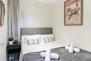 Posteľ alebo postele v izbe v ubytovaní Tendency Apartments Forum 4