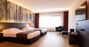 Postel nebo postele na pokoji v ubytování Bastion Hotel Apeldoorn Het Loo