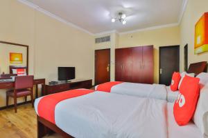 Postel nebo postele na pokoji v ubytování Grand PJ Hotel