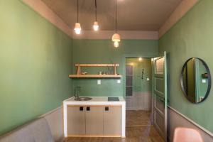 a bathroom with a sink and a mirror at Beautiful best location apartment Green Mouse in Plovdiv +43 photos