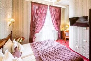 Postel nebo postele na pokoji v ubytování Hotel Atlas Deluxe