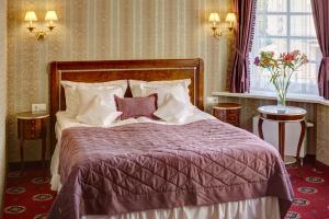 Postel nebo postele na pokoji v ubytování Hotel Atlas Deluxe