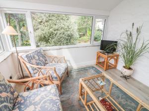 a living room with two chairs and a table at The Bothy in Sedbergh