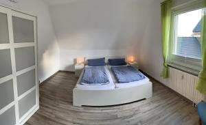 Postel nebo postele na pokoji v ubytování Ferienwohnung am Wiehen