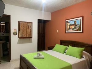 Säng eller sängar i ett rum på Hotel Las Nieves