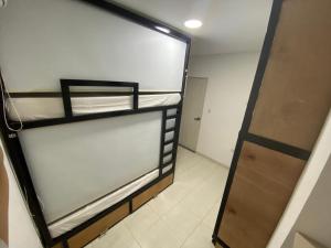 Letto o letti in una camera di Nueve Uno Hostel